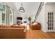 Inviting living room featuring hardwood floors, a cozy fireplace, and a staircase, ideal for gatherings at 1008 Stream Valley Ct, Alpharetta, GA 30022