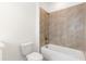Bathroom features white toilet and a tiled shower with tub at 1032 Robert Smalls Way, Atlanta, GA 30318