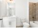 Bright bathroom features a white vanity, a toilet, and a tiled shower with tub at 1032 Robert Smalls Way, Atlanta, GA 30318