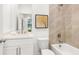 Stylish bathroom with a bathtub and shower, modern fixtures, and tiled walls at 1032 Robert Smalls Way, Atlanta, GA 30318