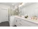 Modern bathroom featuring dual vanity, quartz countertops, glass-enclosed shower at 1032 Robert Smalls Way, Atlanta, GA 30318