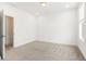 Spacious, bright bedroom features neutral carpet, recessed lighting, and a window at 1032 Robert Smalls Way, Atlanta, GA 30318