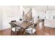 Open-concept dining room with hardwood floors, view of staircase, and modern decor at 1032 Robert Smalls Way, Atlanta, GA 30318