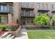 Charming brick townhome with private balconies and landscaped front yard, under a sunny sky at 1032 Robert Smalls Way, Atlanta, GA 30318