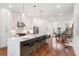 Open-concept kitchen featuring a center island with seating, stainless steel appliances, and bright lighting at 1032 Robert Smalls Way, Atlanta, GA 30318