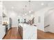 Modern kitchen with an island, white cabinetry, wood floors and stainless steel appliances at 1032 Robert Smalls Way, Atlanta, GA 30318