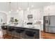 Open kitchen with quartz countertops, island with bar seating and stainless steel appliances at 1032 Robert Smalls Way, Atlanta, GA 30318