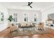 Inviting living room with hardwood floors, neutral decor, and plenty of natural light at 1032 Robert Smalls Way, Atlanta, GA 30318