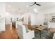 Spacious living room featuring hardwood floors, open layout, and views of the kitchen and staircase at 1032 Robert Smalls Way, Atlanta, GA 30318