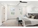 Bright main bedroom with large windows, soft carpet, ceiling fan, and neutral decor at 1032 Robert Smalls Way, Atlanta, GA 30318
