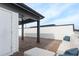 A rooftop deck features a covered area with a sofa, offering shaded comfort with views of the surrounding landscape at 1032 Robert Smalls Way, Atlanta, GA 30318