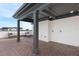 An open rooftop deck with tiled flooring, and partially covered with an outdoor sofa, offers a spot for relaxation at 1032 Robert Smalls Way, Atlanta, GA 30318