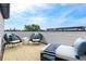 This staged rooftop patio features brick flooring and a beautiful view of the city skyline at 1032 Robert Smalls Way, Atlanta, GA 30318