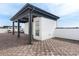 A rooftop patio features a covered sitting area, brown tiled flooring, and views of the city skyline at 1032 Robert Smalls Way, Atlanta, GA 30318