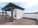 A rooftop patio features a covered sitting area, brown tiled flooring, and views of the city skyline at 1032 Robert Smalls Way, Atlanta, GA 30318