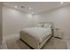 Bedroom featuring neutral decor, plush bed, and a nightstand with a lamp for a relaxing ambiance at 10610 Kingsmark Trl, Alpharetta, GA 30022