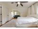 Cozy bedroom with hardwood flooring and a ceiling fan at 10610 Kingsmark Trl, Alpharetta, GA 30022