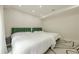 Bright bedroom with two beds, modern furnishings, and a tranquil ambiance for a comfortable stay at 10610 Kingsmark Trl, Alpharetta, GA 30022
