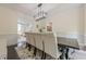 Well appointed dining room with seating for 8, and access to the playroom at 10610 Kingsmark Trl, Alpharetta, GA 30022