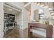 Inviting foyer featuring hardwood floors, staircase, and a view into the home office, blending elegance with functionality at 10610 Kingsmark Trl, Alpharetta, GA 30022