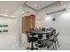 Spacious game room with poker table, sleek lighting, and modern finishes for entertaining guests at 10610 Kingsmark Trl, Alpharetta, GA 30022