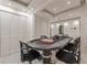 Well-lit game room featuring poker table with Monopoly game, recessed lighting, and stylish decor at 10610 Kingsmark Trl, Alpharetta, GA 30022