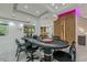 Bright game room with poker table, wet bar, wine storage, and stylish decor for entertaining at 10610 Kingsmark Trl, Alpharetta, GA 30022
