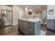 Open concept kitchen with a large island, stainless steel appliances, and hardwood floors at 10610 Kingsmark Trl, Alpharetta, GA 30022