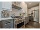 Modern kitchen featuring stainless steel appliances, white cabinets, and a center island at 10610 Kingsmark Trl, Alpharetta, GA 30022