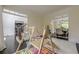 Bright playroom with indoor swing and access to formal dining and main floor at 10610 Kingsmark Trl, Alpharetta, GA 30022