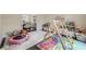 Playroom with soft rug, swing, and mini-trampoline provides a fun, engaging space for  at 10610 Kingsmark Trl, Alpharetta, GA 30022