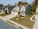 Beautiful two-story home with a well-manicured lawn and mature trees in a quiet neighborhood at 221 Eleanora Way, Loganville, GA 30052