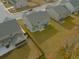 Aerial view of a home with a spacious backyard in a suburban neighborhood at 221 Eleanora Way, Loganville, GA 30052