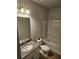 Well-lit bathroom with tub, shower, vanity, and sleek countertops at 221 Eleanora Way, Loganville, GA 30052