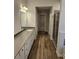 Bathroom with stylish vanity, wood-look flooring, and a glass-enclosed shower at 221 Eleanora Way, Loganville, GA 30052