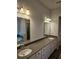Bathroom featuring double sinks with lots of counter space at 221 Eleanora Way, Loganville, GA 30052