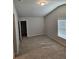 Spacious bedroom featuring a vaulted ceiling and a neutral color palette, perfect for relaxation at 221 Eleanora Way, Loganville, GA 30052