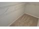 Spacious walk-in closet with ample shelving for optimal organization and storage solutions at 221 Eleanora Way, Loganville, GA 30052