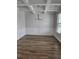 Dining room with coffered ceilings, wainscoting, and hardwood floors at 221 Eleanora Way, Loganville, GA 30052