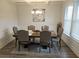Formal dining room boasting natural light, with a dining table perfect for gatherings at 221 Eleanora Way, Loganville, GA 30052