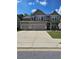 Charming two-story home featuring a three-car garage and well-maintained landscaping at 221 Eleanora Way, Loganville, GA 30052