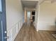 Elegant entryway featuring a hardwood floor and decorative wall paneling for a polished look at 221 Eleanora Way, Loganville, GA 30052