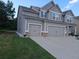 Attached garage for two vehicles providing ample space for parking and storage at 221 Eleanora Way, Loganville, GA 30052