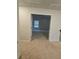 Hallway showcasing the seamless flow between rooms with neutral walls and carpeted flooring at 221 Eleanora Way, Loganville, GA 30052