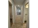 Upstairs hallway featuring carpet flooring and an open landing with metal railings at 221 Eleanora Way, Loganville, GA 30052