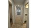 Carpeted second floor hallway with access to multiple rooms at 221 Eleanora Way, Loganville, GA 30052