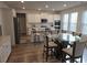 Bright eat-in kitchen with stainless steel appliances, white cabinets, and counter seating at 221 Eleanora Way, Loganville, GA 30052