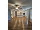 Open kitchen with stainless appliances, white cabinetry, and large center island at 221 Eleanora Way, Loganville, GA 30052