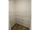 Walk-in pantry with ample wire shelving for organized storage at 221 Eleanora Way, Loganville, GA 30052
