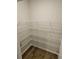 Walk-in pantry featuring wire shelving for ample storage space at 221 Eleanora Way, Loganville, GA 30052